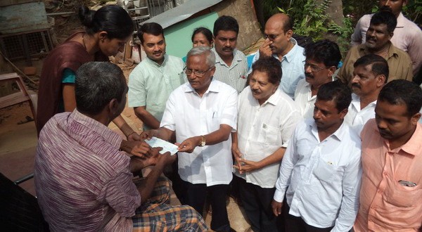 J.R. Lobo hands over relief to families for monsoon damage